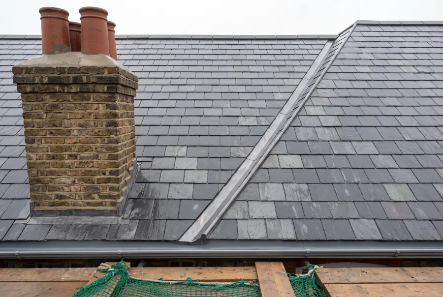 Ealing semi re-covered in natural slate with new lead flashings and dry verges